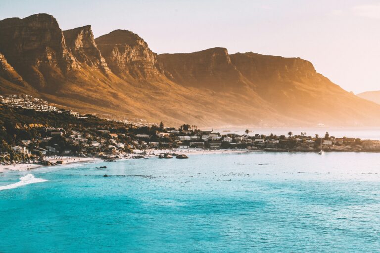 Table Mountain and coastline in Cape Town, South Africa, captured at sunset.