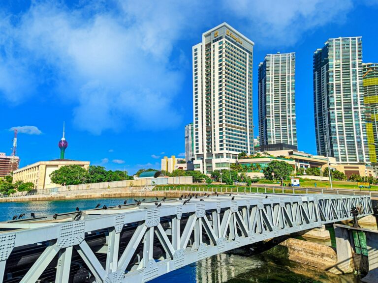 Image of Colombo city skyline, Sri Lanka, with the Lotus Tower and modern buildings.