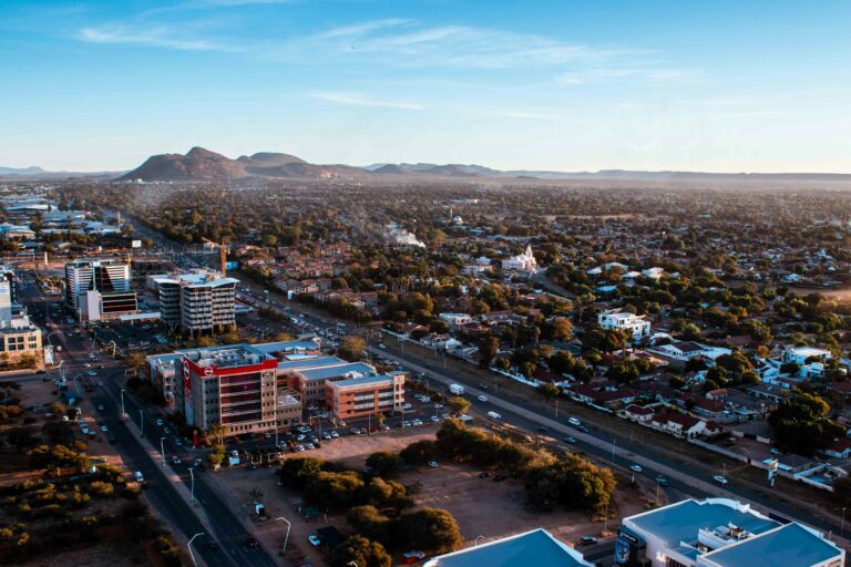 Panoramic view of Gaborone showcasing modern buildings and distant hills.
