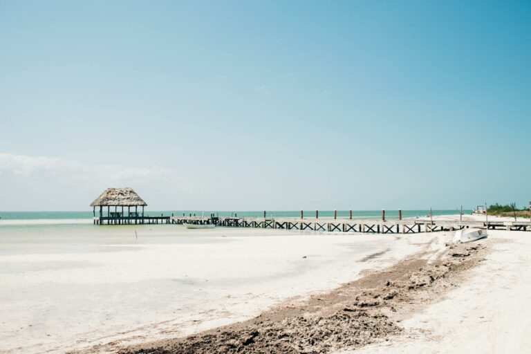 Beach and pier on Holbox Island, Mexico, on a clear day.
