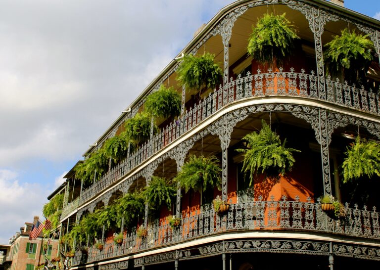 Historic French Quarter building with wrought-iron balconies in New Orleans.